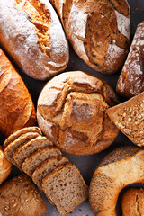 Assorted bakery products including loafs of bread and rolls