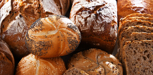 Assorted bakery products including loafs of bread and rolls