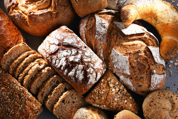 Assorted bakery products including loafs of bread and rolls