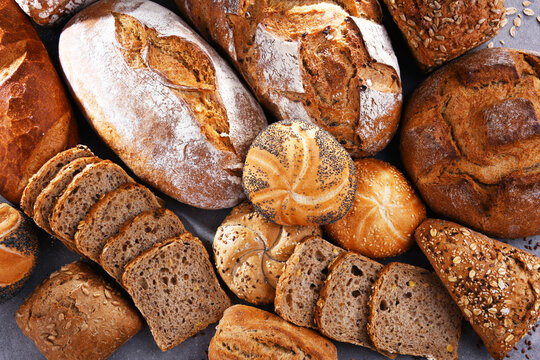 Assorted bakery products including loafs of bread and rolls - Powered by Adobe