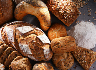 Assorted bakery products including loafs of bread and rolls