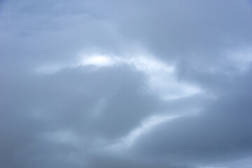 Blue-gray clouds in the sky before the rain. Light in dark and dramatic storm clouds. Perfect natural sky background, mock up for design