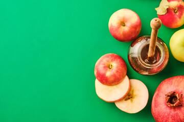 Rosh hashanah jewish New Year holiday concept. Apples, honey, pomegranate