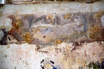 illustrations from the bible on the wall of an abandoned temple