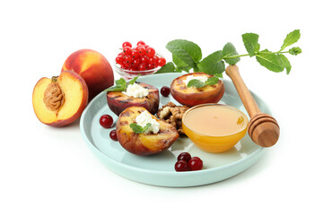 Plate with grilled peach isolated on white background