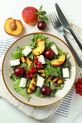 Concept of tasty food with salad with grilled peach, top view
