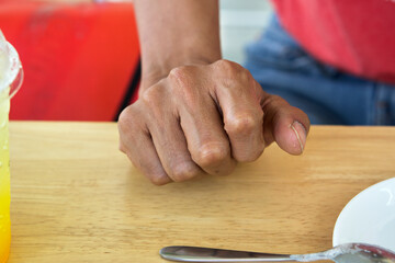 Placed on top of a Wooden Table ,Close up of male hand on wooden table, Middle aged man relaxing ,Young man sitting at table ,Close up of middle aged man gesturing with arms and hand