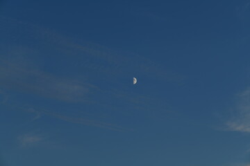 half moon in the dark blue sky