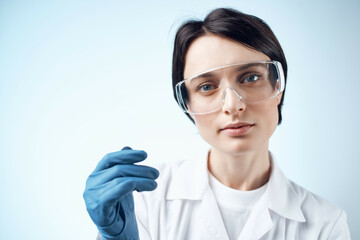Woman laboratory assistants in white coat winter gloves research test biology