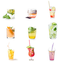 Glasses of tasty cold lemonade with basil on white background