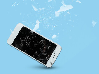Mobile phone with cracked glass screen on color background