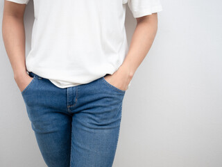 Man white shirt and hand in jean pocket portrait crop shot