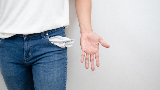 Man white shirt standing open hand with empty jean pocket copy space