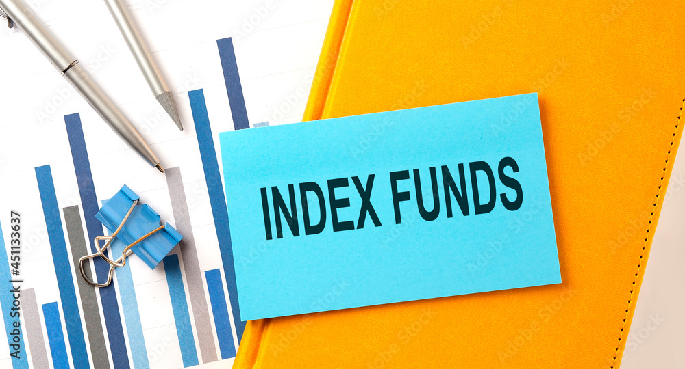 Poster index funds text on sticker on the yellow notebook with chart and pen