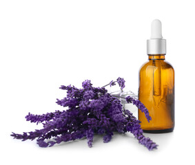 Bottle of lavender essential oil and flowers on white background