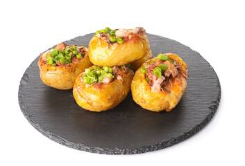 Slate plate with baked potato on white background