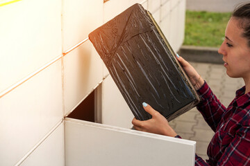 Postal terminal. Post delivery automat service and hands with parcel courier box. Mail delivery and...