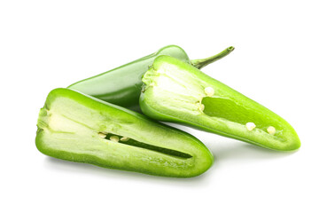 Pieces of green jalapeno pepper on white background