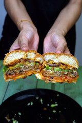 Chef holding a beef burger