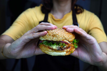 Chef holding a beef burger