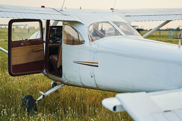 Picture of private plane parked on the airdrome - obrazy, fototapety, plakaty