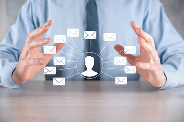 Male hand holding letter icon,email icons .Contact us by newsletter email and protect your personal information from spam mail. Customer service call center contact us.Email marketing and newsletter
