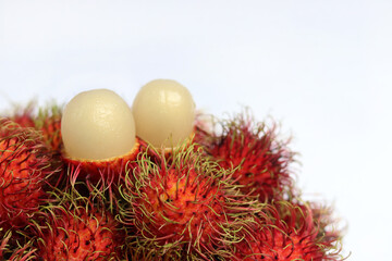 Fototapeta na wymiar Rambutan on white background. A Sweet delicious fruit with health benefits ranging from weight loss and better digestion to increased resistance to infections.