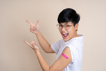 Happy asian people smiling after receiving vaccination, with copy space.