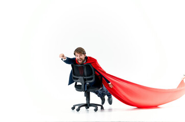 Fototapeta premium business man with red cloak in the chair hero superman