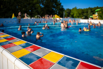 Fototapeta na wymiar Edge of swimming pool in summer