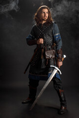 Medieval knight with sword in armor as style Game of Thrones
