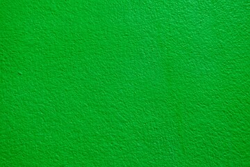 Concrete walls that were painted over with dark green paint.