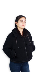 Hispanic teenage woman wearing black sheep jacket on white background. Fashion concept