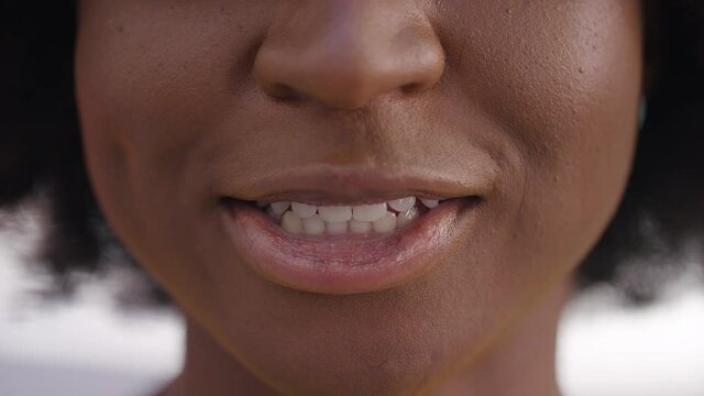 Close Shot Of Female's Mouth Talking Directly To Camera, Vox Pop Style