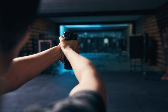Female shooter mastering a two-handed hold during the shooting drill