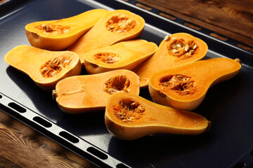 Raw organic butternut squash cut in half