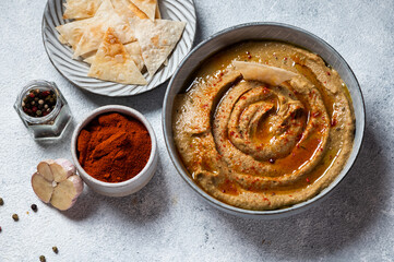 Arabic food baba ganoush close-up on the plate and ingredients on the table. Babaganush or eggplant caviar. Baked eggplant. Turkish eggplant dip baba ganoush