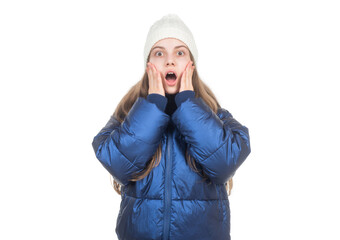 shocked teen girl in knitted hat puffer padded jacket warm clothes isolated on white, down jacket.