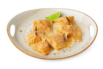Italian dish ravioli in plate isolated on white background