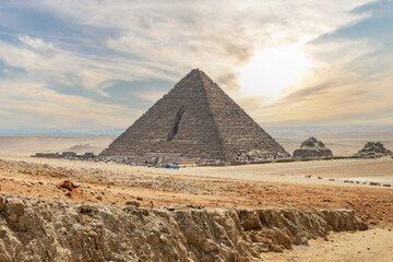 Fototapeta na wymiar The Great Pyramid of Menkaure with dramatic sky in the Giza, Egypt.