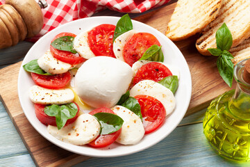 Caprese salad with mozzarella, basil and garden tomatoes