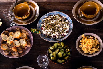 Plates with delicious homemade dishes on a wooden table outdoors in the country