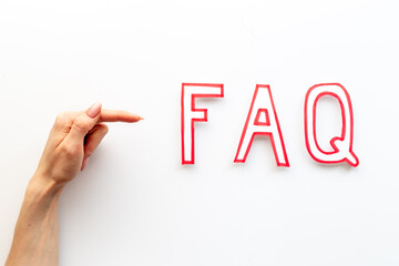 Hands with faq - frequently asked questions - made of paper