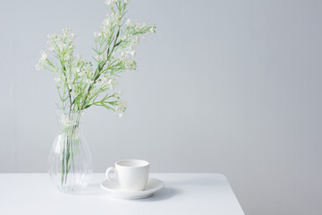 white coffee cup on a white table.