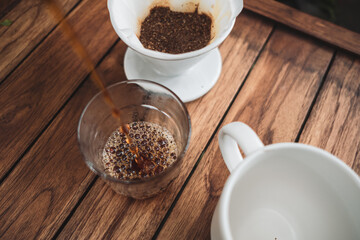 barista dripping coffee and slow coffee wooden bar style