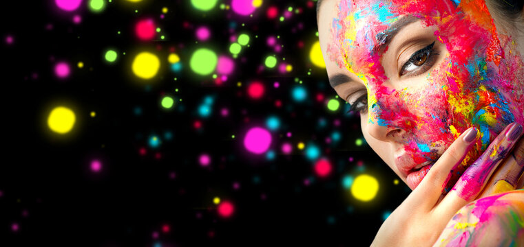 Fashion Art Model Girl colorful face paint. Beauty art portrait, beautiful woman with painting smears, abstract makeup. Vivid paint make-up, bright colors. Multicolor creative make-up. 