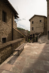 a young man walking into the little street of Vallo di nera, Umbria