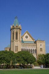 Landscape view of Frere Hall, ancient colonial era architecture landmark in Karachi, Pakistan
