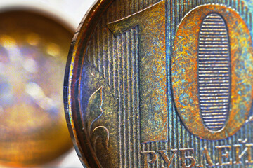 A fragment of a Russian coin in 10 ten rubles close-up. Bright impressive illustration about economy, finance and banks of Russia. Macro