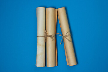 Old scrolls on a blue background. Knowledge and education concept. There is a place for an inscription or logo